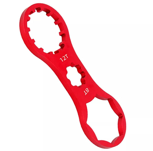 Raktas amortizatoriaus dangteliams